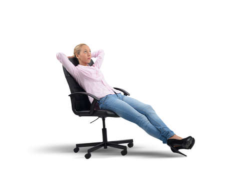 Businesswoman relaxes thinking of her new projectsの写真素材