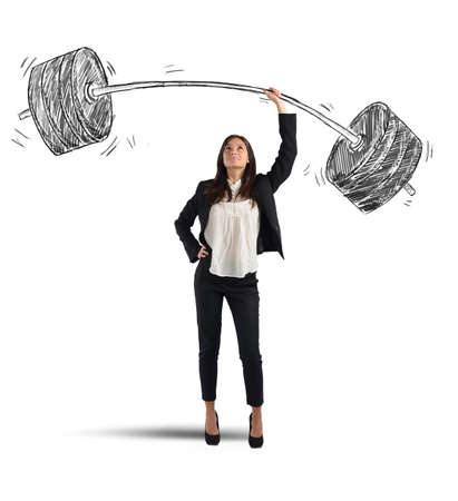 A businesswoman solves lightly every weight workの写真素材