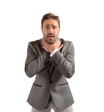 Businessman tries to strangle himself to despairの写真素材