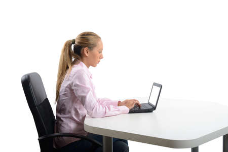 Businesswoman work in her office with laptopの写真素材