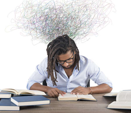 Concentrated man reading book that inspires himの写真素材