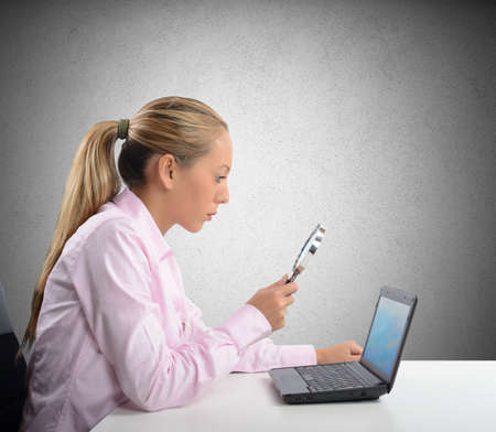 A businesswoman check and verify her computerの写真素材