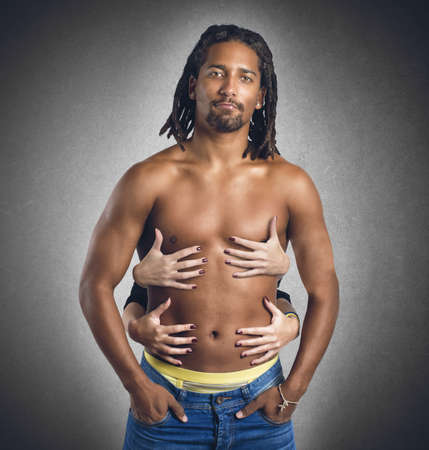 Sexy man touched by many women handsの写真素材