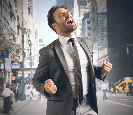 Businessman screaming happy after reaching a goalの写真素材
