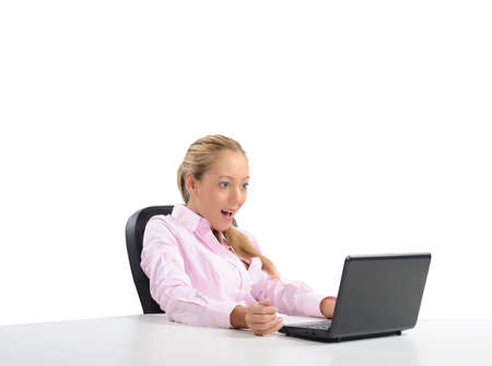 Businesswoman amazed by its budget on laptopの写真素材