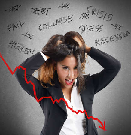 Businesswoman screaming furiously because of lower profitsの写真素材
