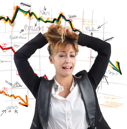 Exhausted businesswoman despairs for the financial collapseの写真素材