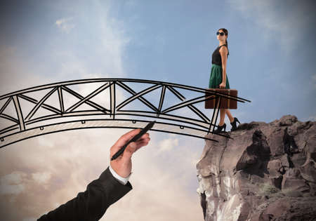 Woman crosses a bridge with her suitcaseの写真素材