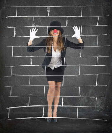 Businesswoman plays to mime imagining a wallの写真素材