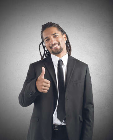 Businessman optimistic smiles to his beautiful careerの写真素材