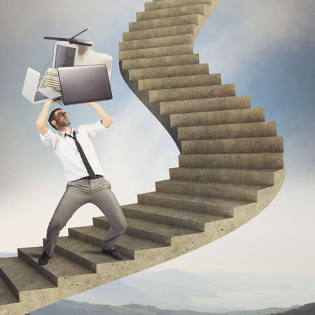 Overload businessman working launches pc from stairs