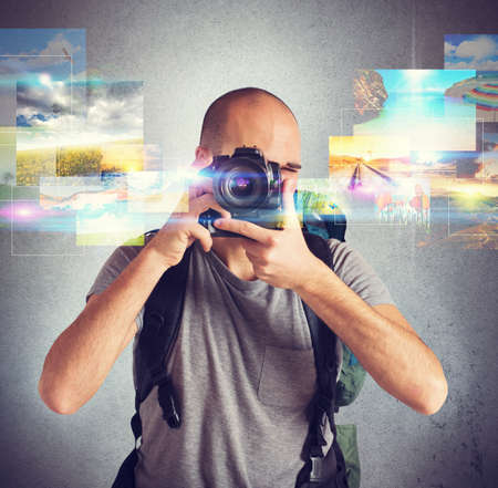 Photographer boy shows his passion for photographyの写真素材