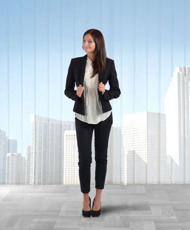 Businesswoman positive satisfied of her company placeの写真素材