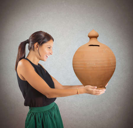 Generous woman happy to give the savingsの写真素材