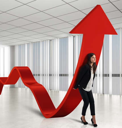 Businesswoman helps the coins to raise statisticsの写真素材
