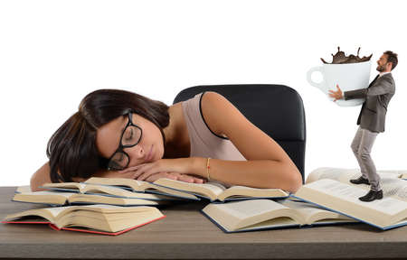 Girl exhausted from study needs a coffeeの写真素材