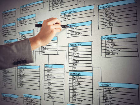 Programmer draws and organizes a new databaseの写真素材