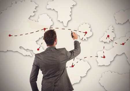 Businessman organizes marketing strategy in the worldの写真素材