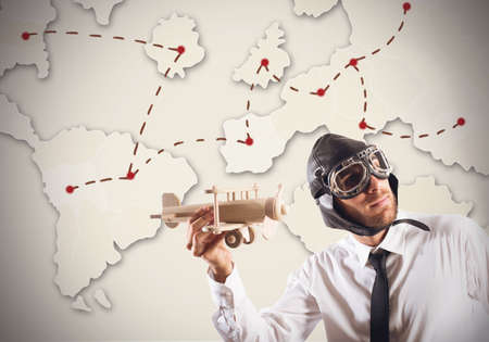 Businessman as pilot around world to workの写真素材