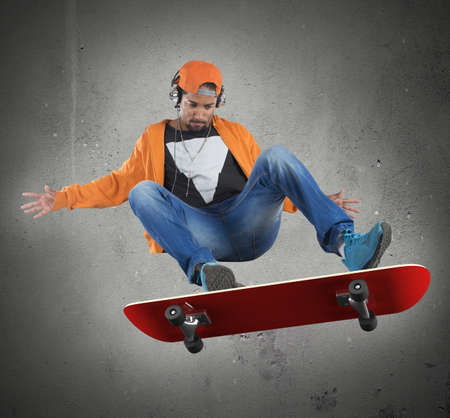 Street boy doing stunts with his skateの写真素材