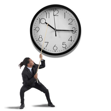 Business man tries to change the timeの写真素材