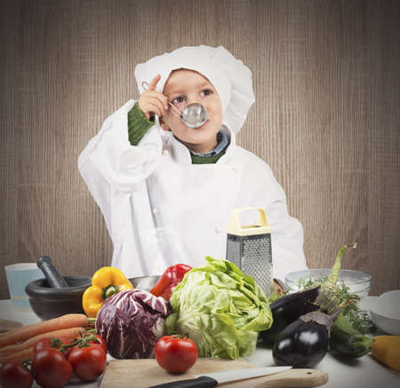 Baby cook tastes the flavor of recipeの写真素材