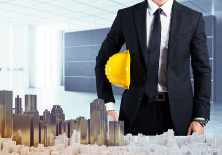 Architect in office shows the urban projectの写真素材