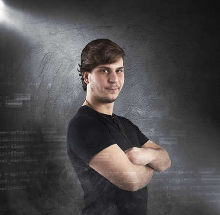 Guy portrait in a black futuristic backgroundの写真素材