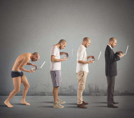 Evolution from hunched man to successful manの写真素材