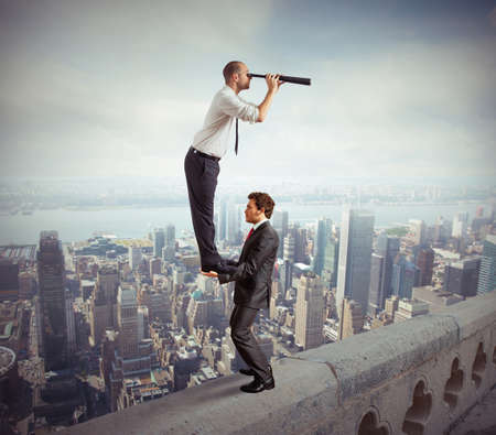 Business people working together to look beyond Business people working together to look beyond