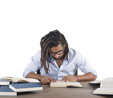 A concentrated man reads an interesting bookの写真素材