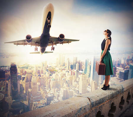 Tourists watch the takeoff of a aircraftの写真素材
