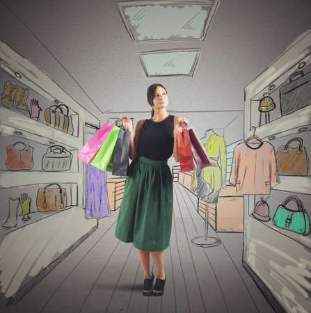 Girl goes shopping in her favorite storeの写真素材