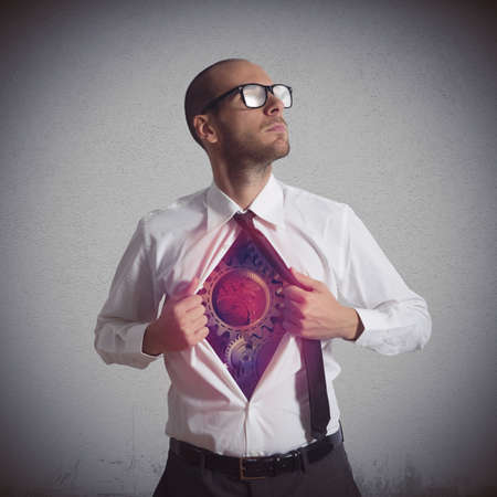 Businessman becomes a super hero of gearの写真素材