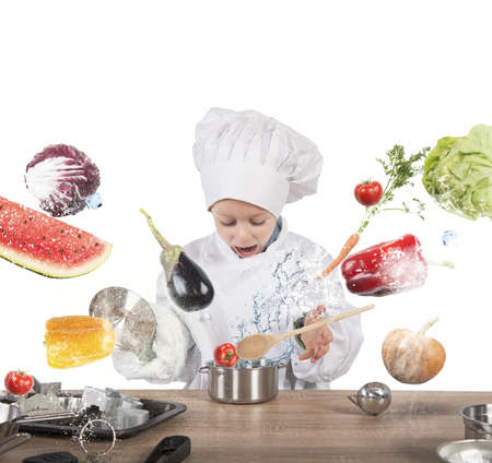 Little child chef playing and having funの写真素材