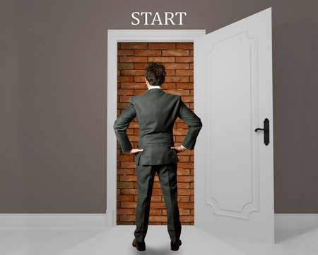 Businessman at the beginning of opportunity hamperedの写真素材