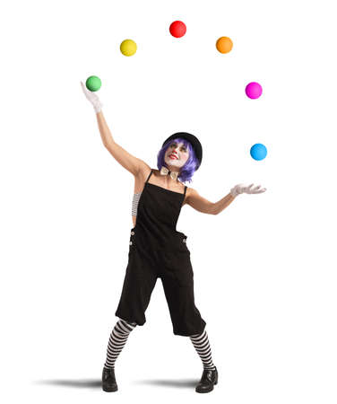 Clown playing with balls like a jugglerの写真素材