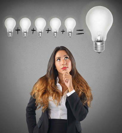 Businesswoman sum various ideas for a brilliant ideaの写真素材