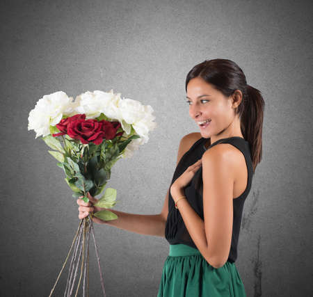 Girl receives a gift of flowers unexpectedの写真素材