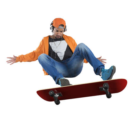 Street boy doing stunts with his skateの写真素材
