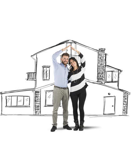 Happy couple in love planning a homeの写真素材