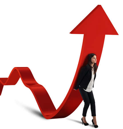 Businesswoman helps the coins to raise statisticsの写真素材