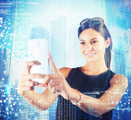 Girl takes a picture with futuristic technologyの写真素材