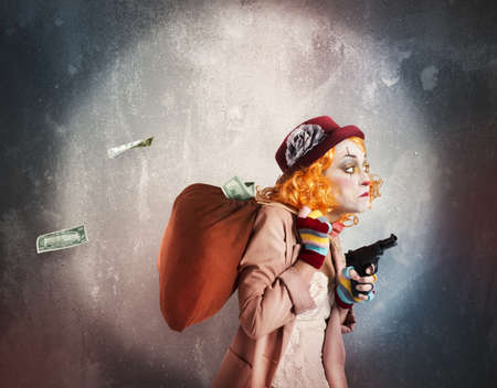 Woman clown discovered while robbing much moneyの写真素材