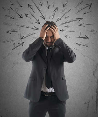 Worried stressed businessman by indecision and problems