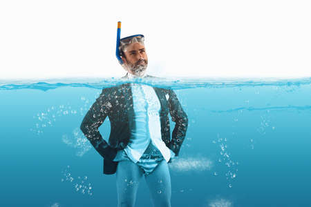 Desperate businessman in debt fight against timeの写真素材