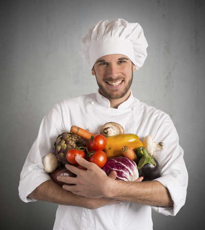 Chef specialized in vegetarian with fresh vegetablesの写真素材