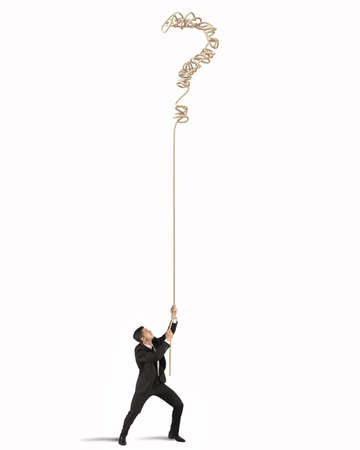 Businessman trying to solve the complicated tangle