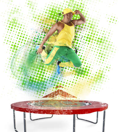 Fitness teacher jumps nimbly on the trampolineの写真素材