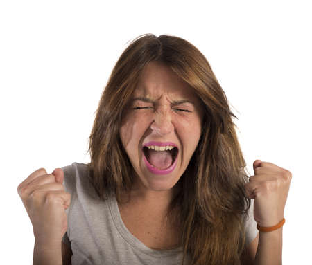 Aggressive businesswoman stressed out from work screamsの写真素材